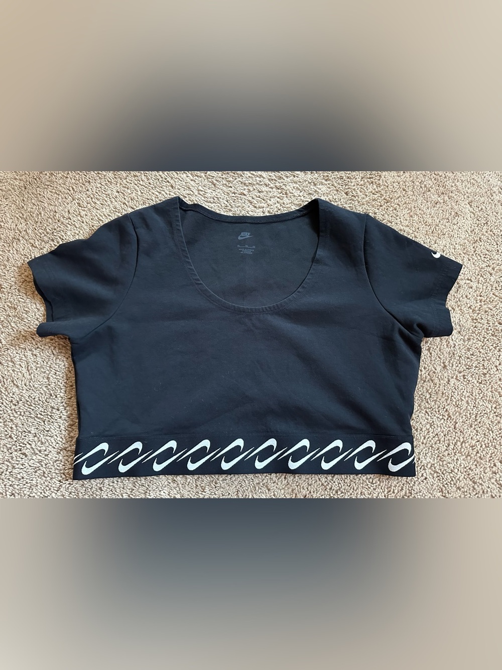 Nike Black Scoop-Neck Cropped Tee with White Wave Trim.